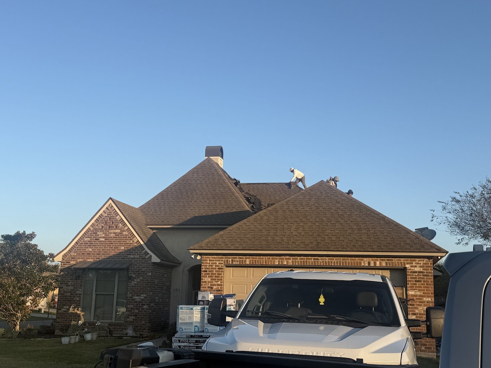 Roof replacement in progress with new underlayment and shingles on Louisiana home