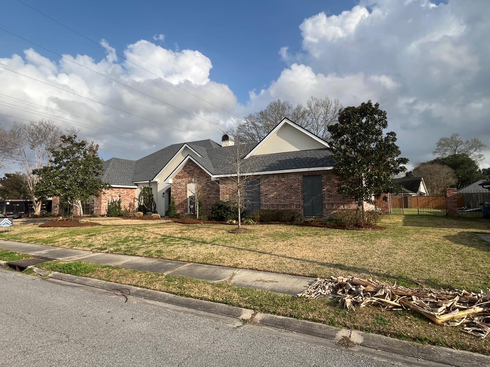 Storm damage roof tear-off and replacement on Acadiana residential home