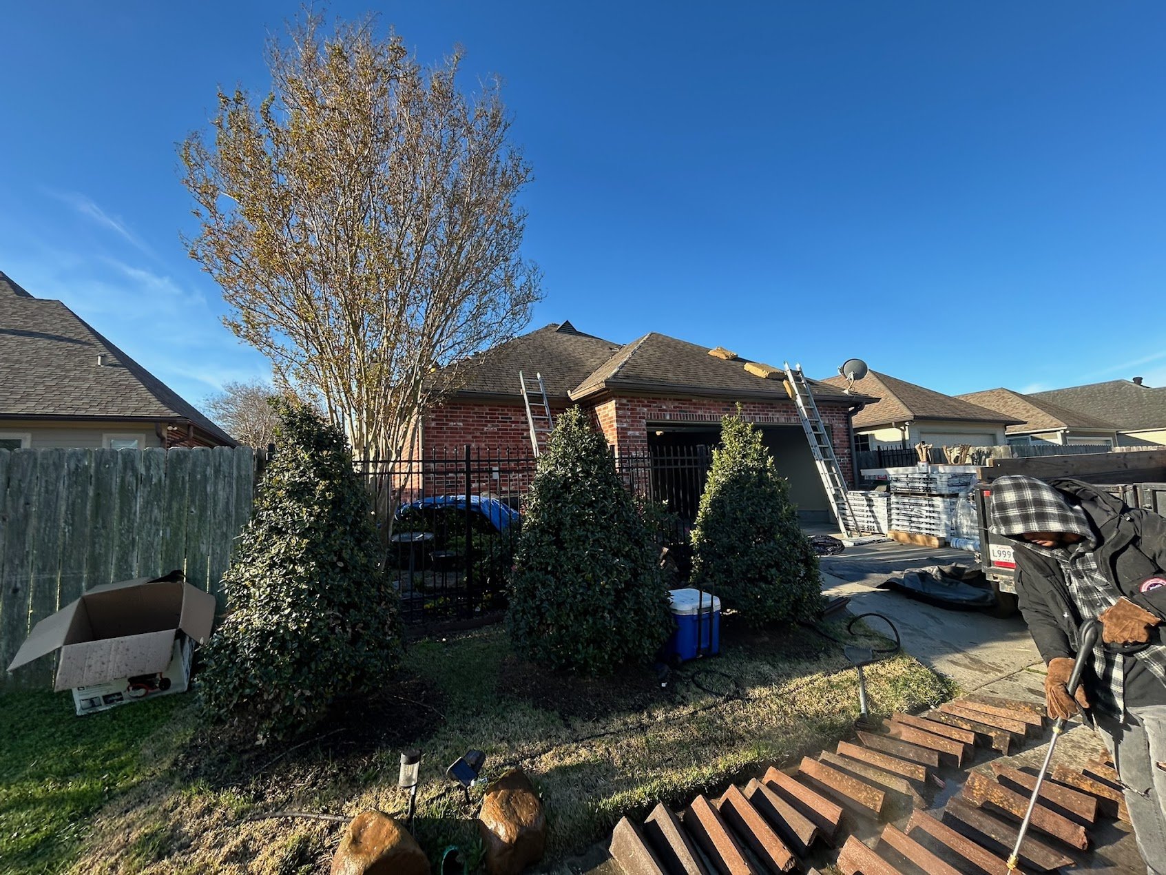 New asphalt shingle roof on brick residential home in Acadiana region