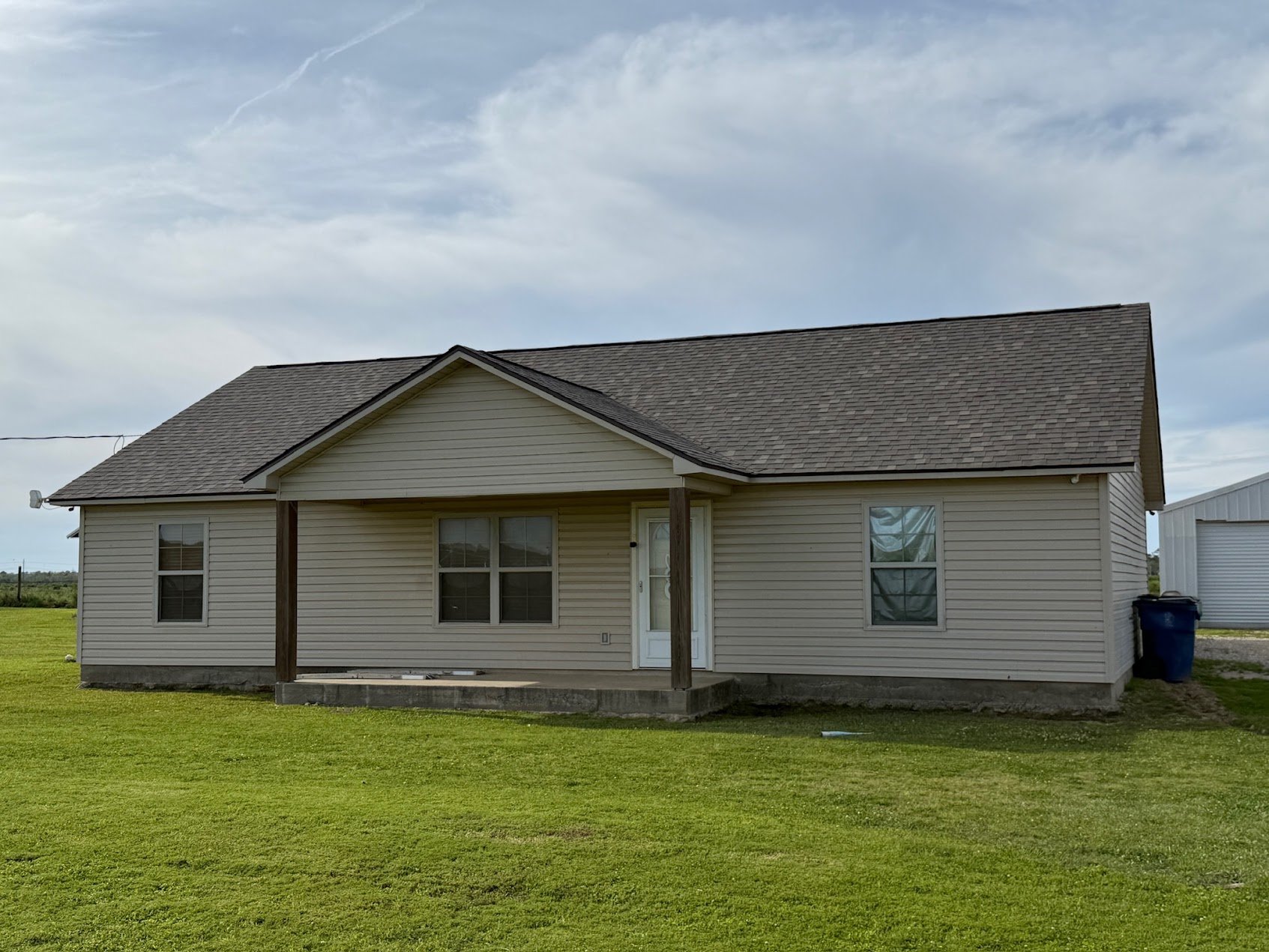 New asphalt shingle roof on brick residential home in Acadiana region