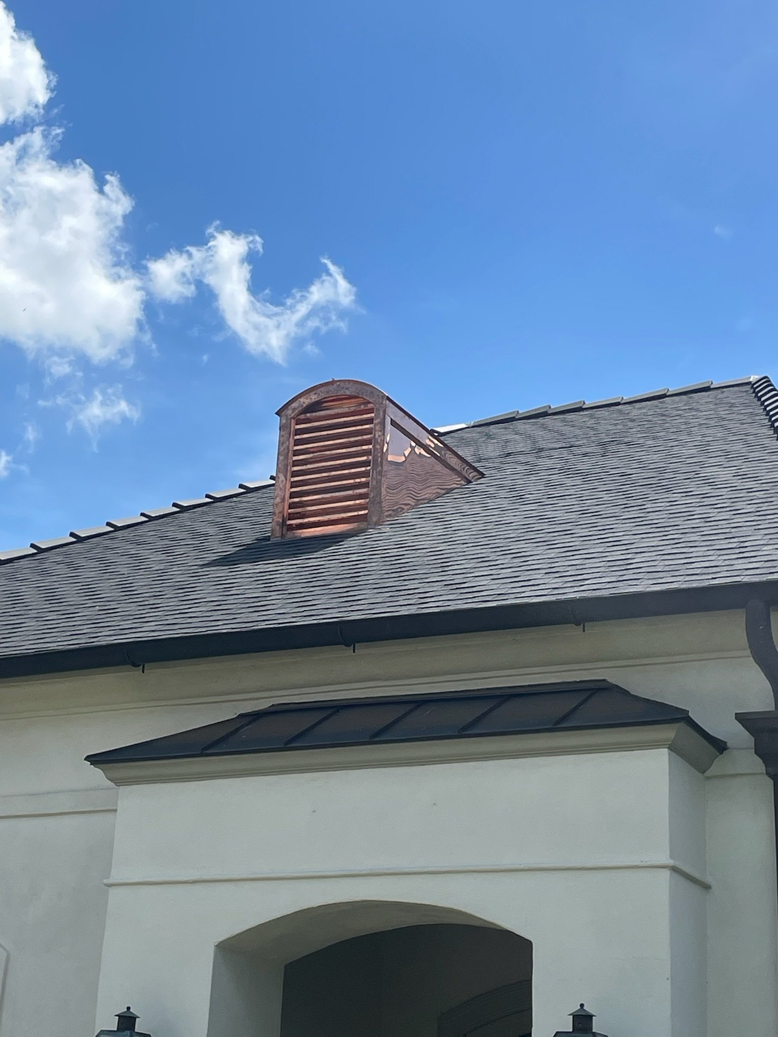 Custom cupola installation on residential asphalt shingle roof